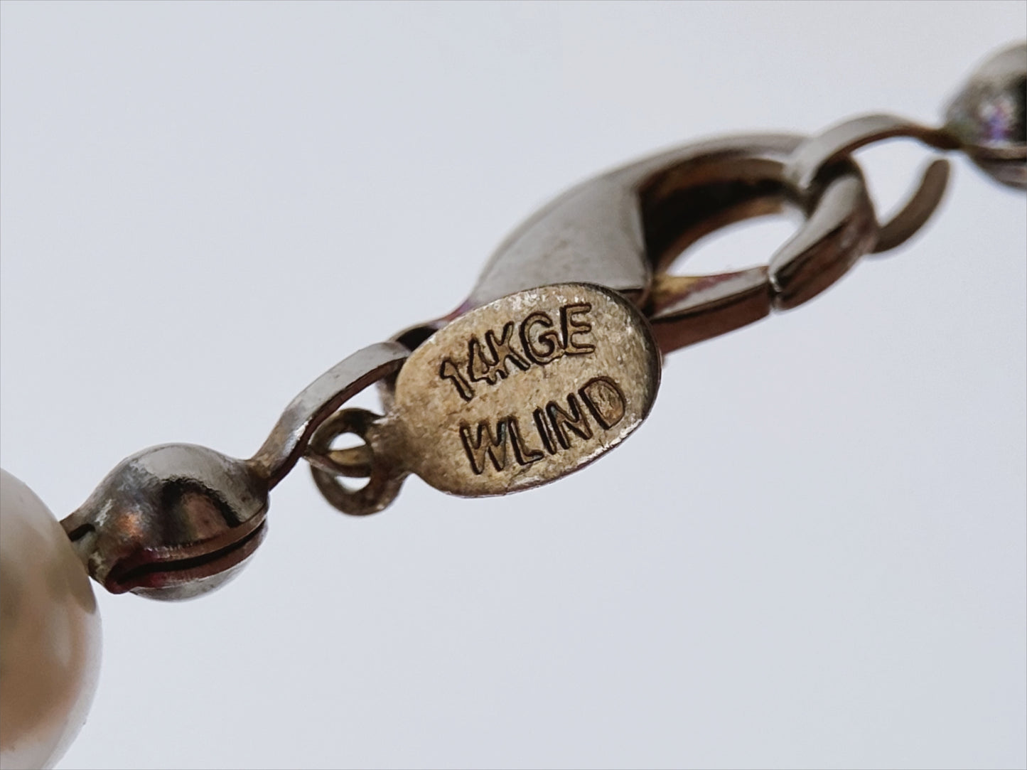 “WLIND” perlų vėrinys