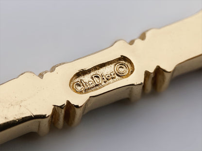 “Christian Dior" paauksuota sagė